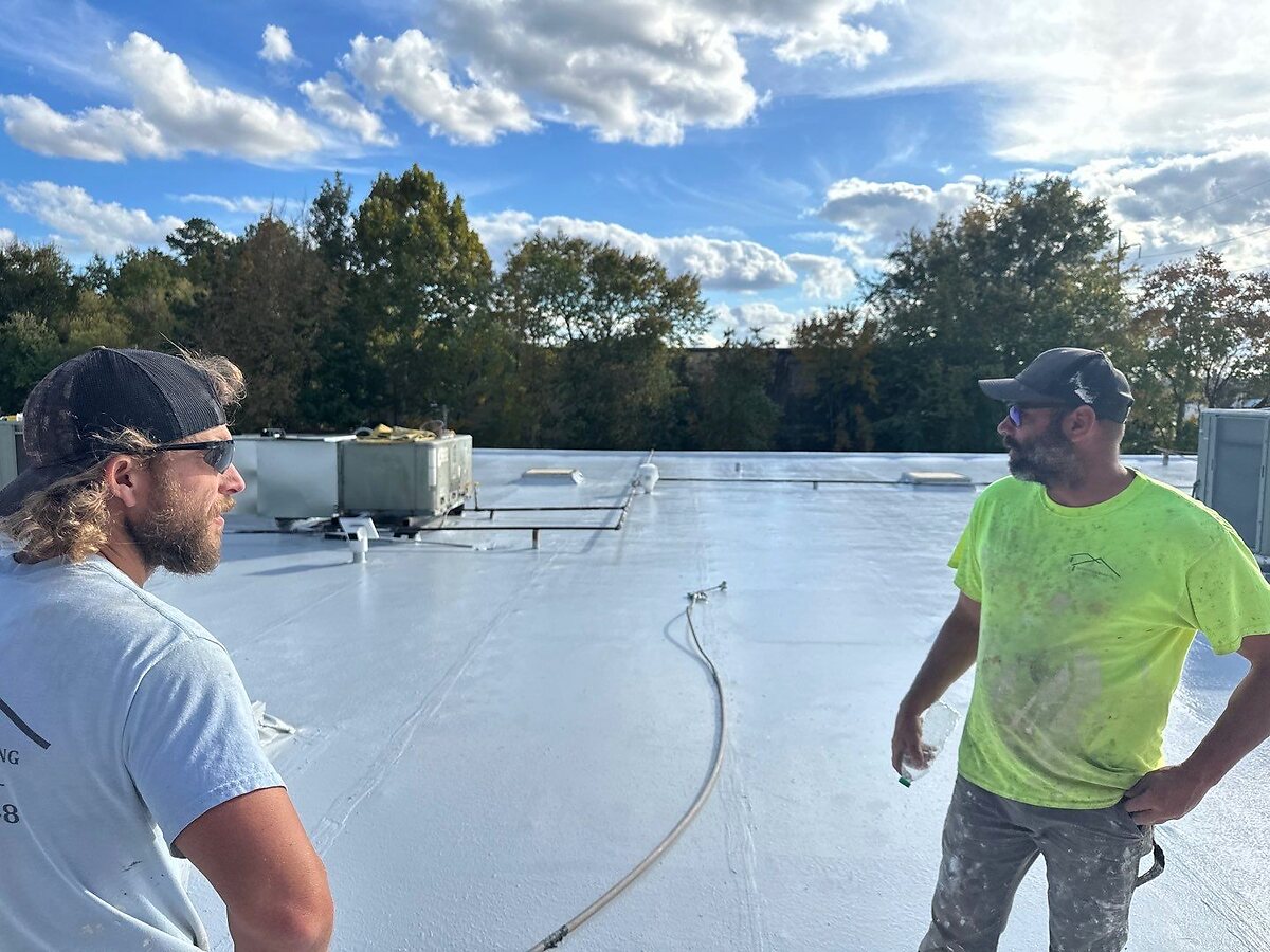 Dickerson commercial roofing crew on a large flat roof