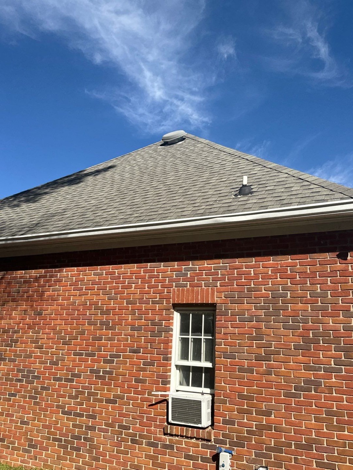 Finished residential roof on a brick home in Brandon