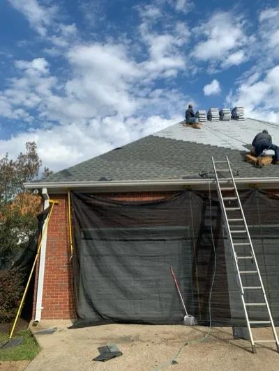 Dickerson crew shingling a brick home